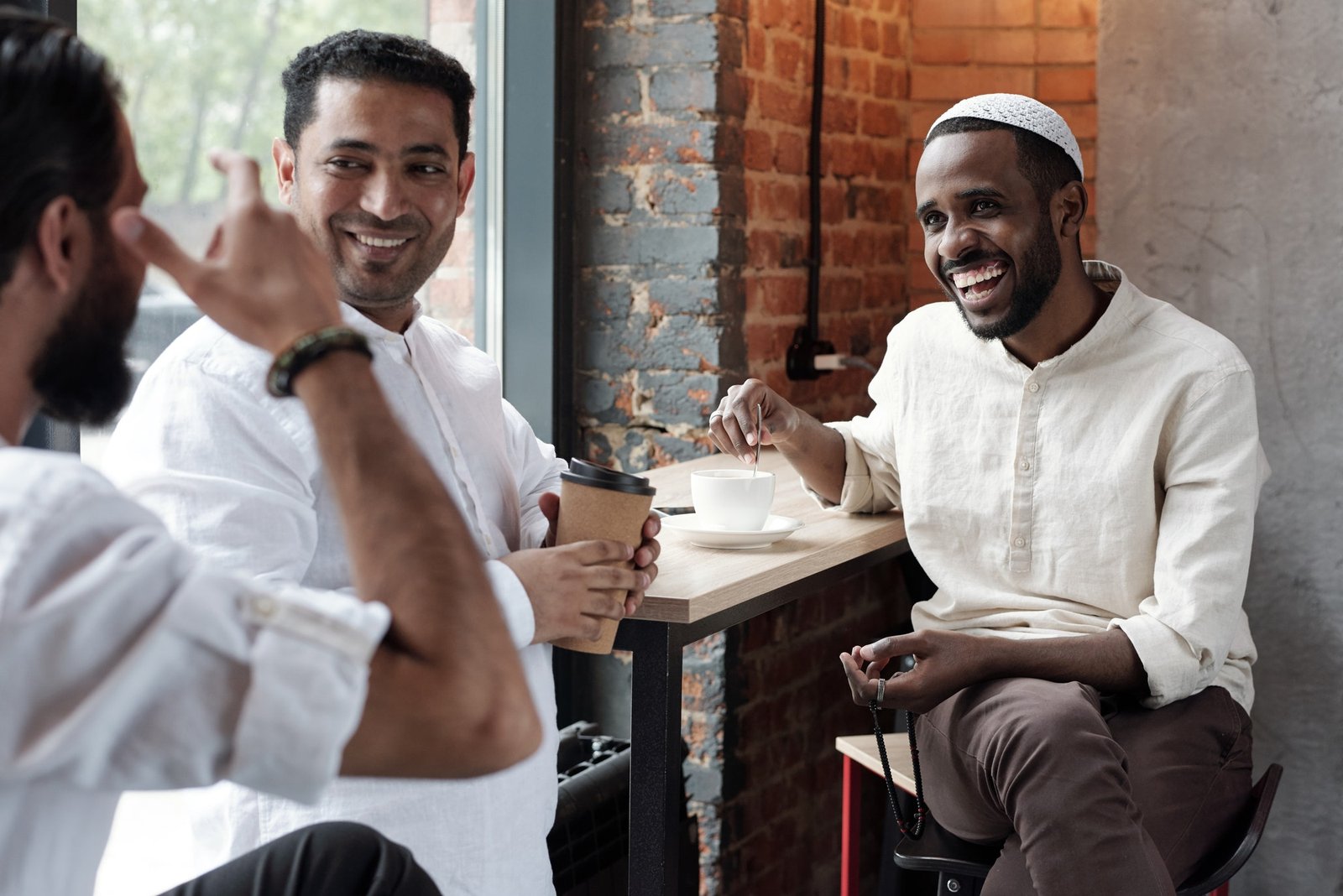 Muslim Friends Gathering In Cafe